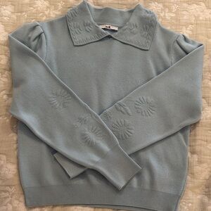 Elegant Light Blue Sweater with Floral Accents